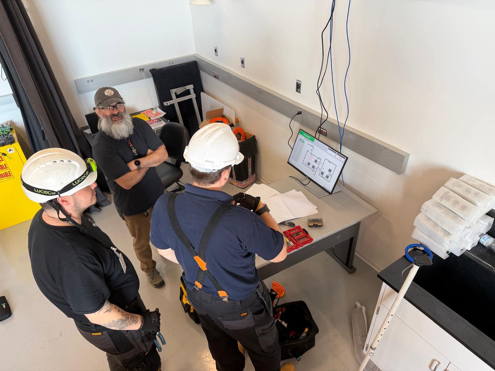 Lasermet Install Engineers and the Control and Laser Monitoring Screen